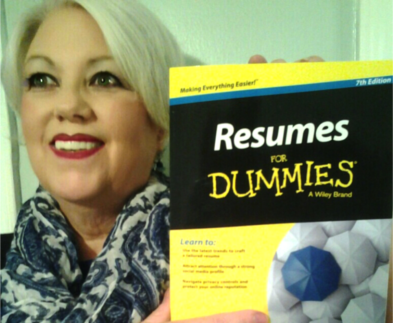 Posey Salem, nationally published resume writer, holding copy of the new 7th Edition of Resumes for Dummies book.